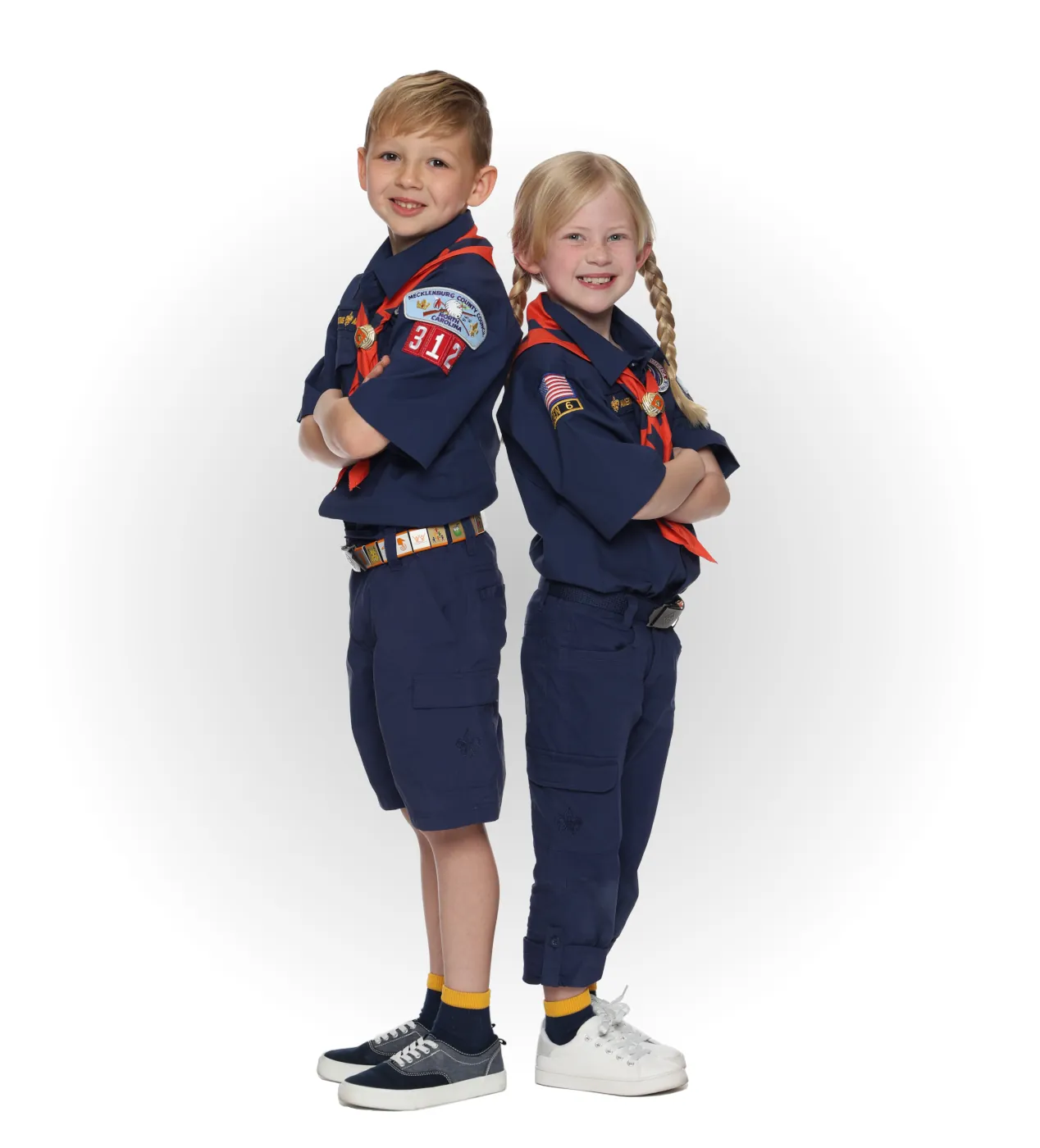 Two Tiger Cub Scouts wearing blue uniforms with orange neckerchiefs.